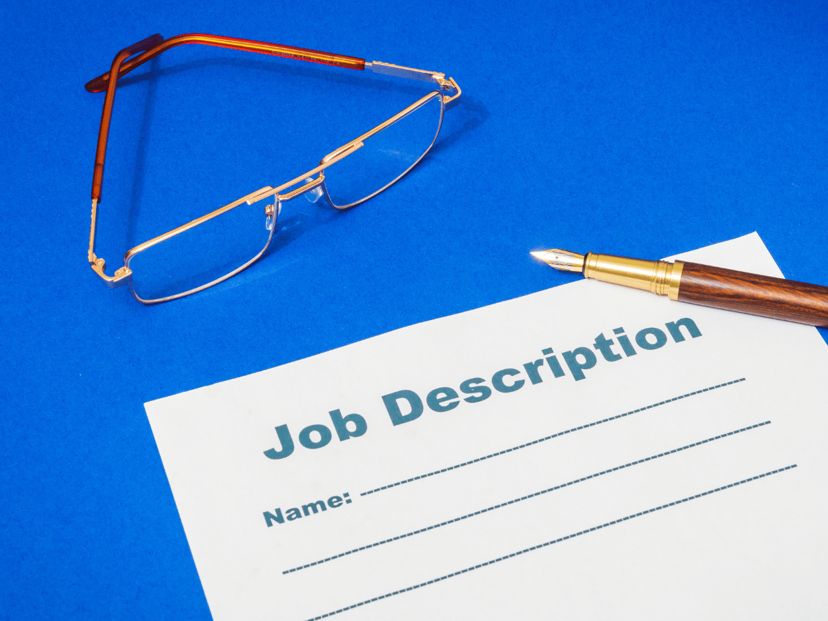 A page titled job description is on a blue background as you need a good job description for recruitment.